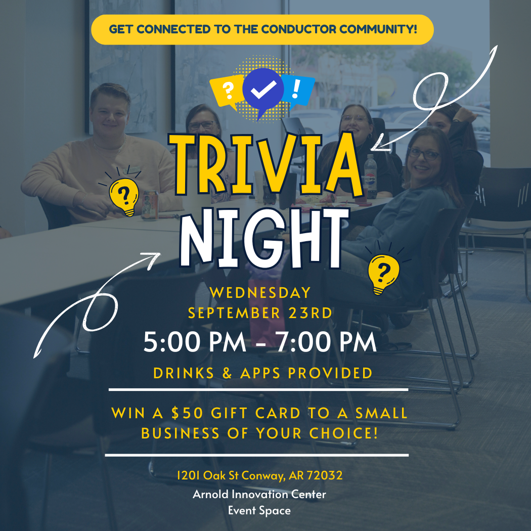 People sitting around a table smiling at a trivia night event flyer, which details event info, prizes, and provided refreshments at the Arnold Innovation Center.